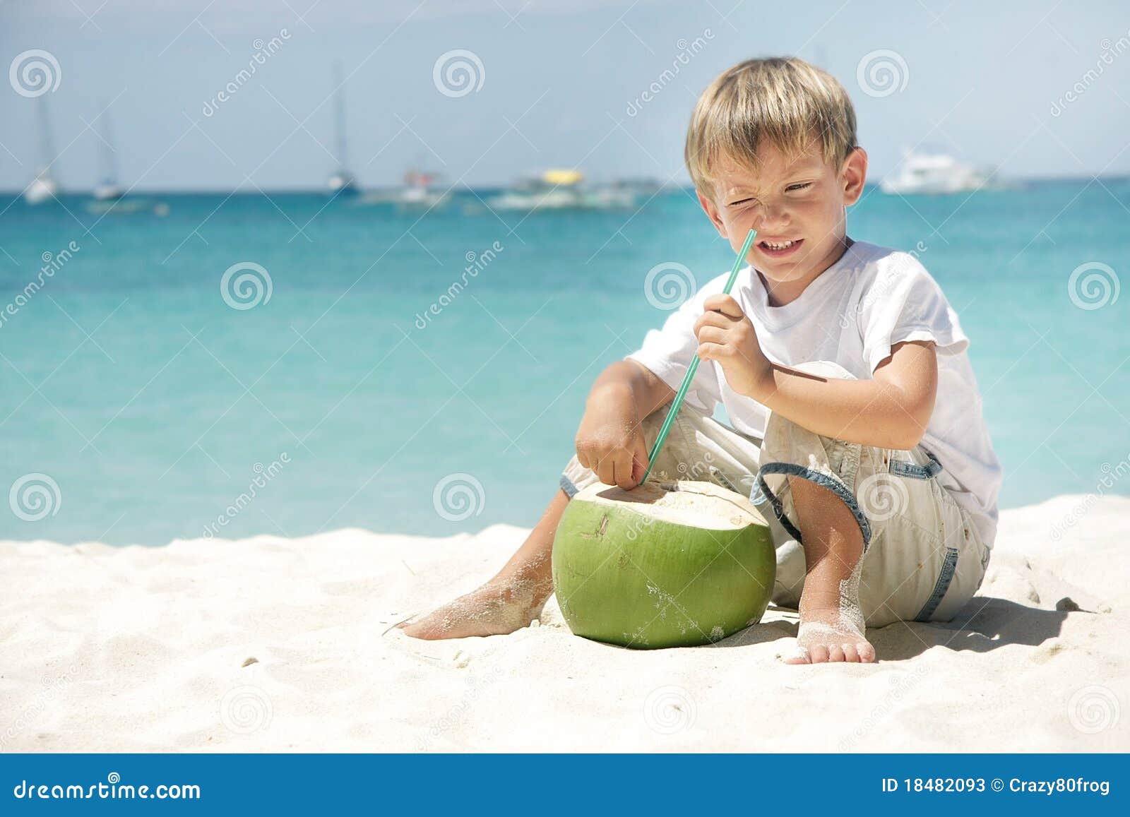 Boy Drinking Coconut Juice On Sea Background RoyaltyFree Stock Photography