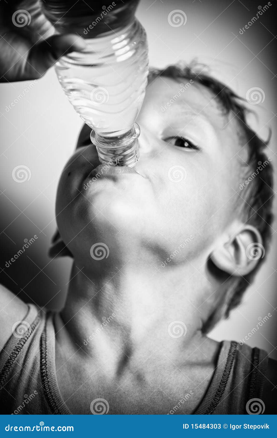 Teen boy drinking water Stock Photo by ©VaLiza 114884958