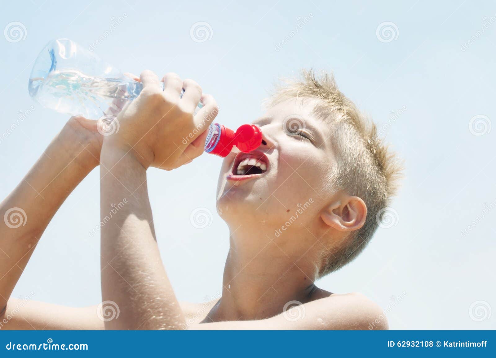 Boy Drinks Water from a Bottle Outdoors Stock Photo - Image of bottle,  happy: 62932108