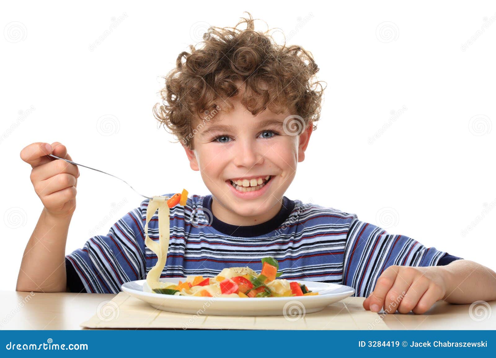 Boy eating stock image. Image of hunger, tasty, fork, table 3284419