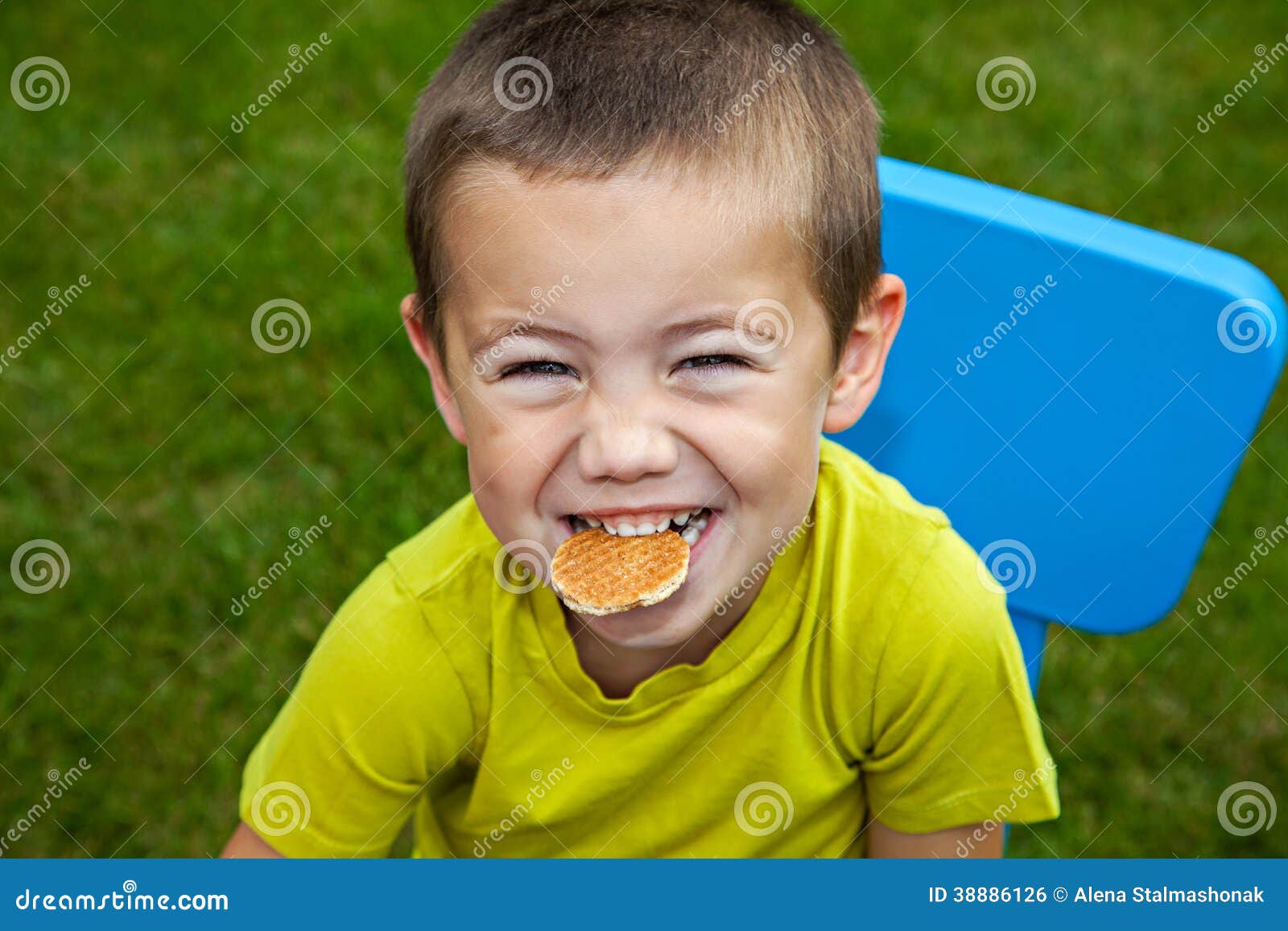 Boy eating biscuit stock photo. Image of biting, children 38886126
