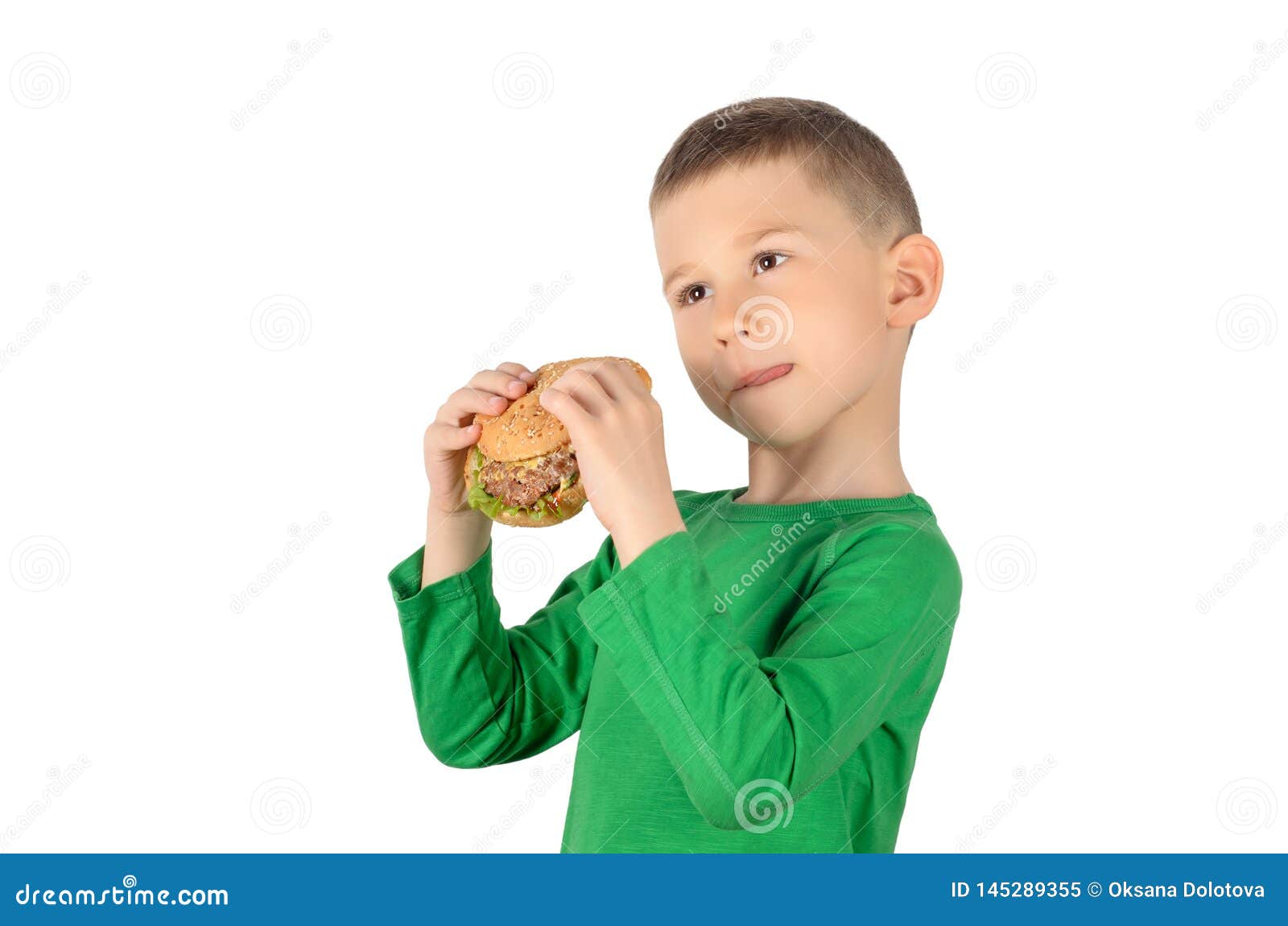 Boy eating burger stock image. Image of cheerful, lunch 145289355