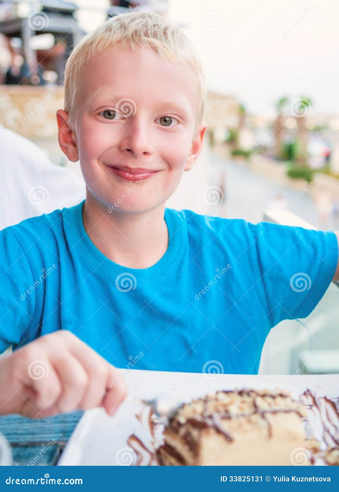 Boy eating a cake stock image. Image of restaurant, elementary 33825131