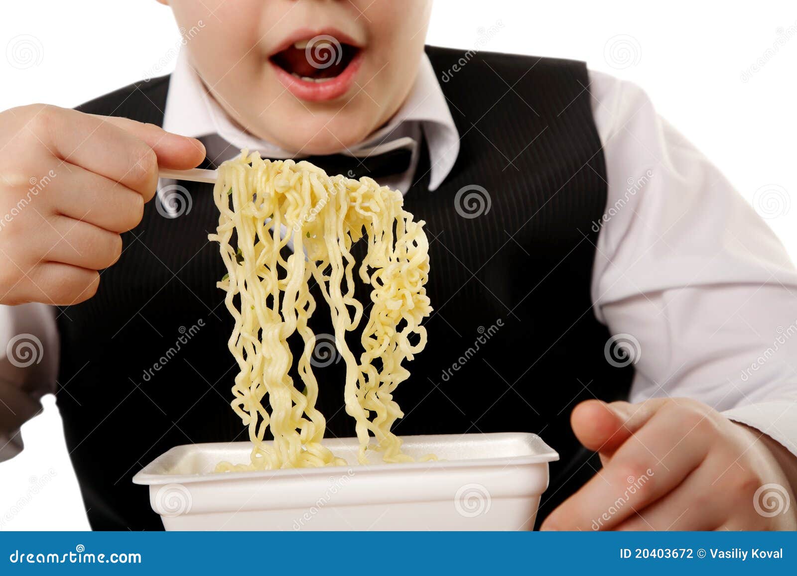 Boy eating instant noodles stock photo. Image of instant 20403672