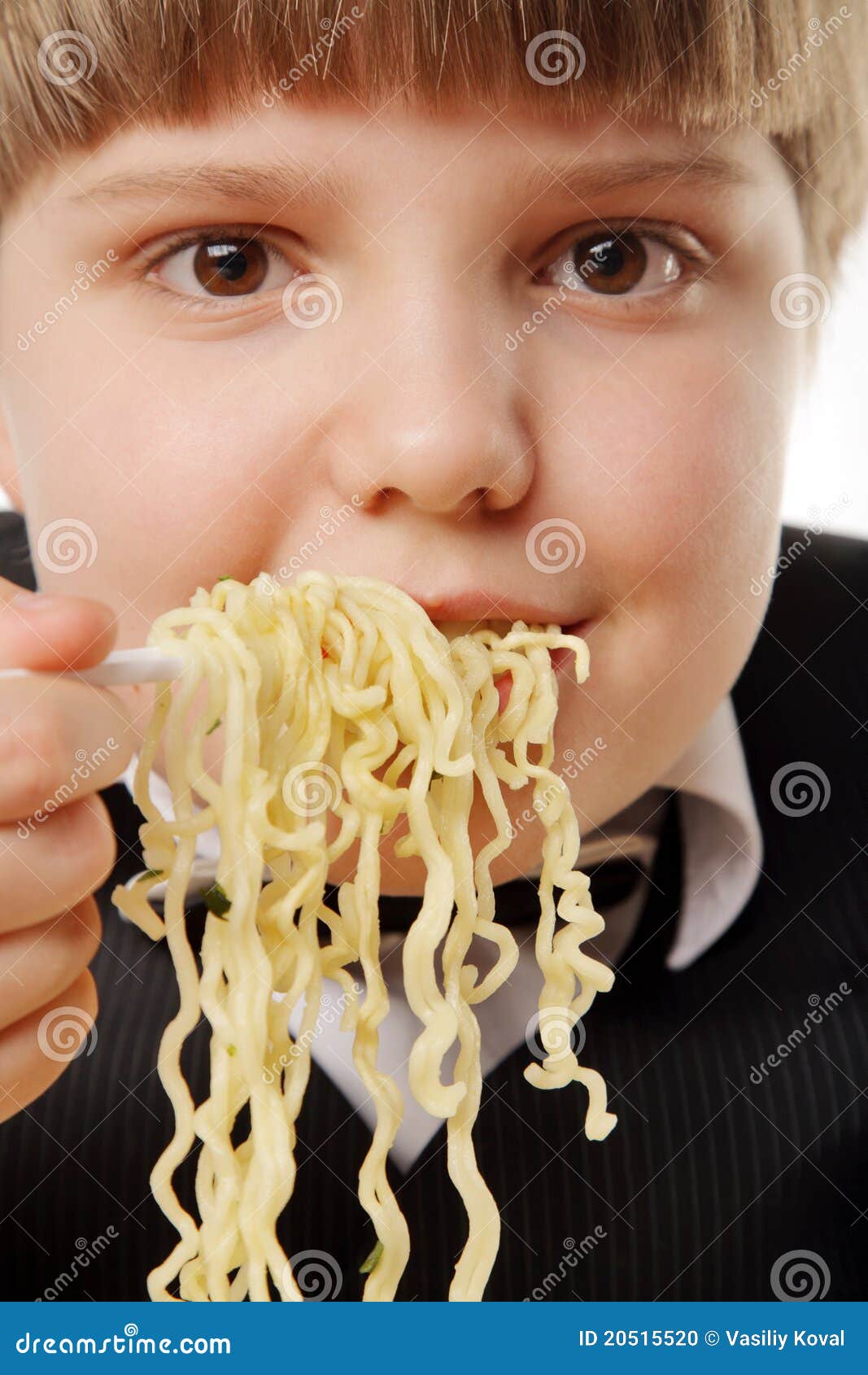 Boy eating instant noodles stock photo. Image of fast 20515520