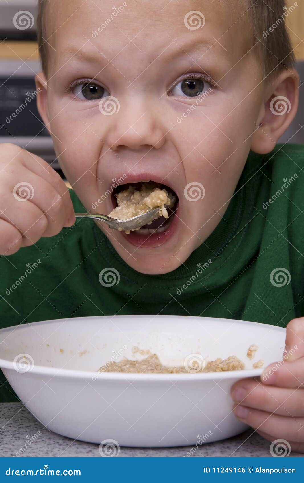 Boy Eating Oatmeal Big Bite Stock Photo Image of breakfast, shirt