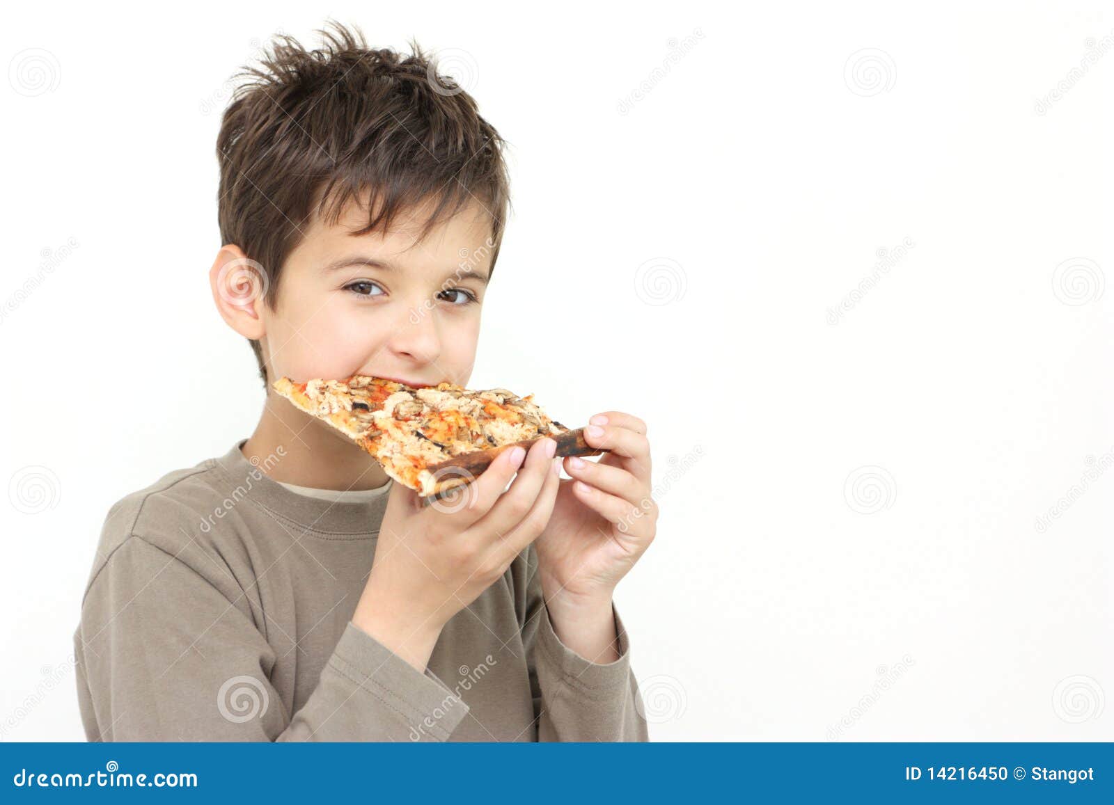 a boy eating pizza