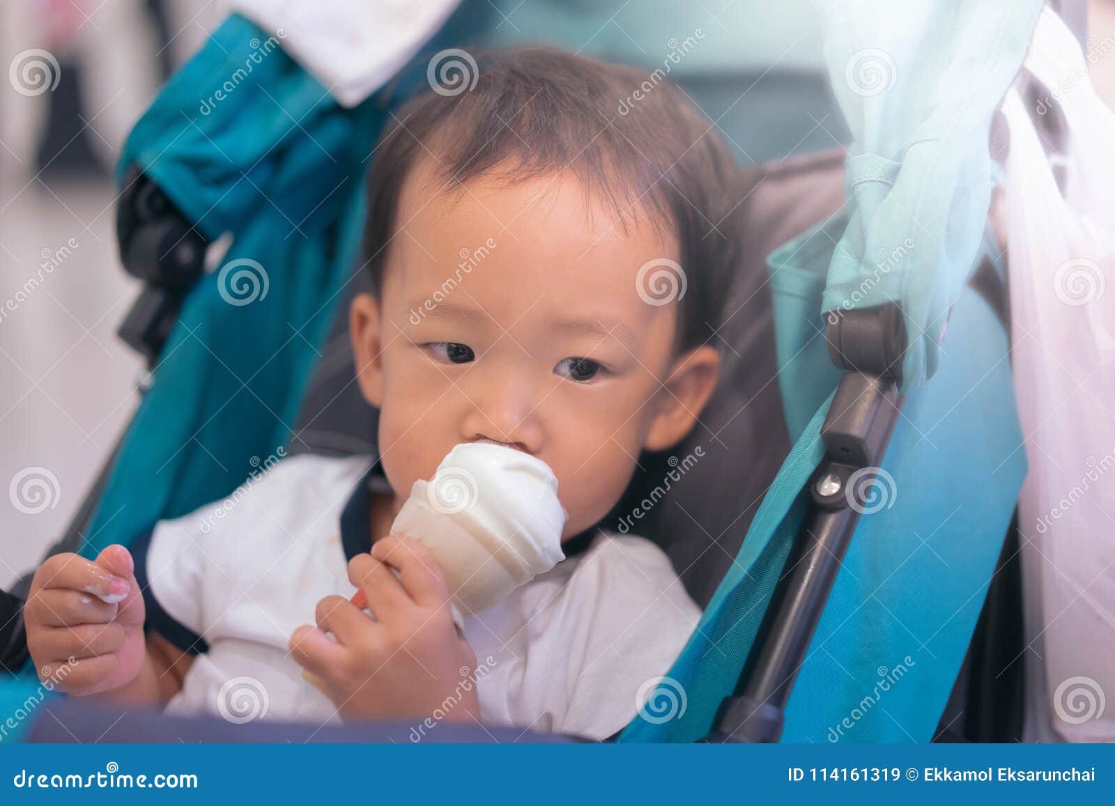 The boy eats ice cream. stock image. Image of people 114161319