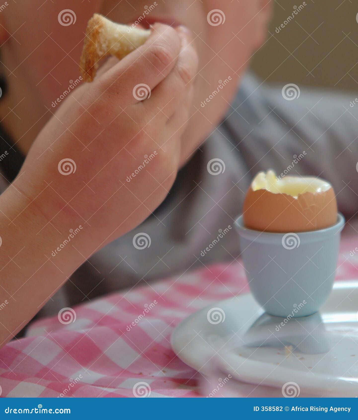 Boy with egg for breakfast stock photo. Image of child 358582