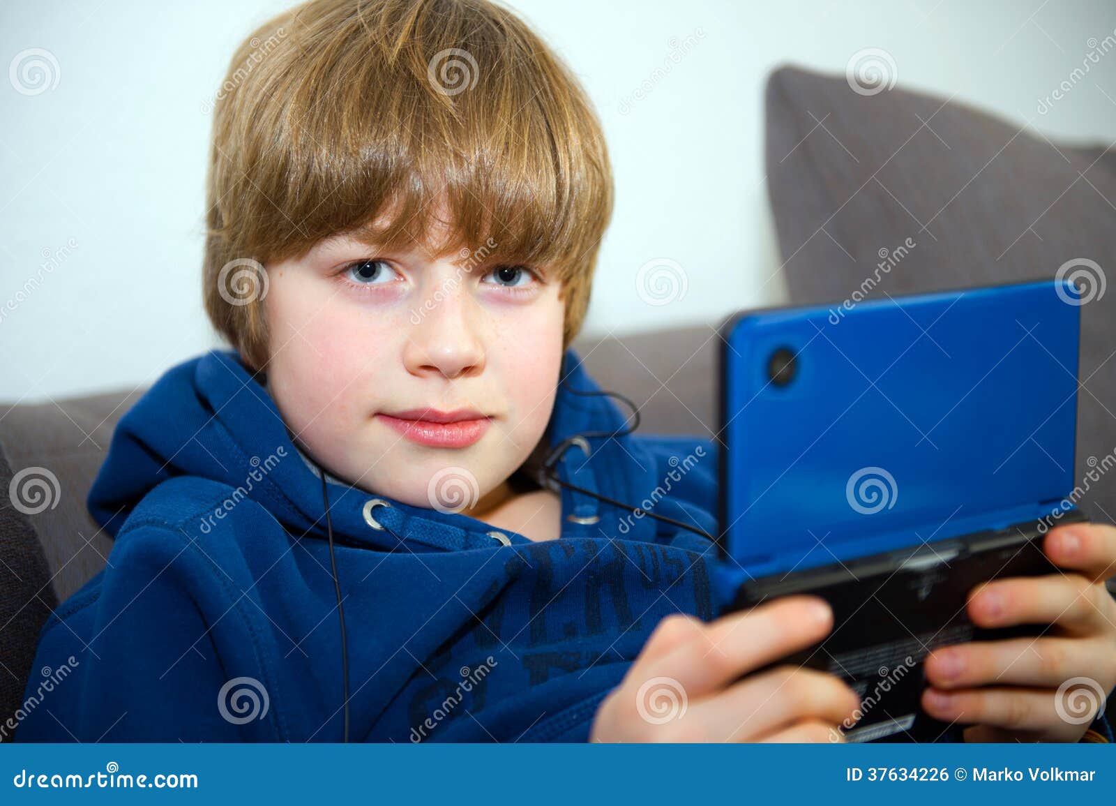 Boy with elektrinic game stock photo. Image of face, music - 37634226