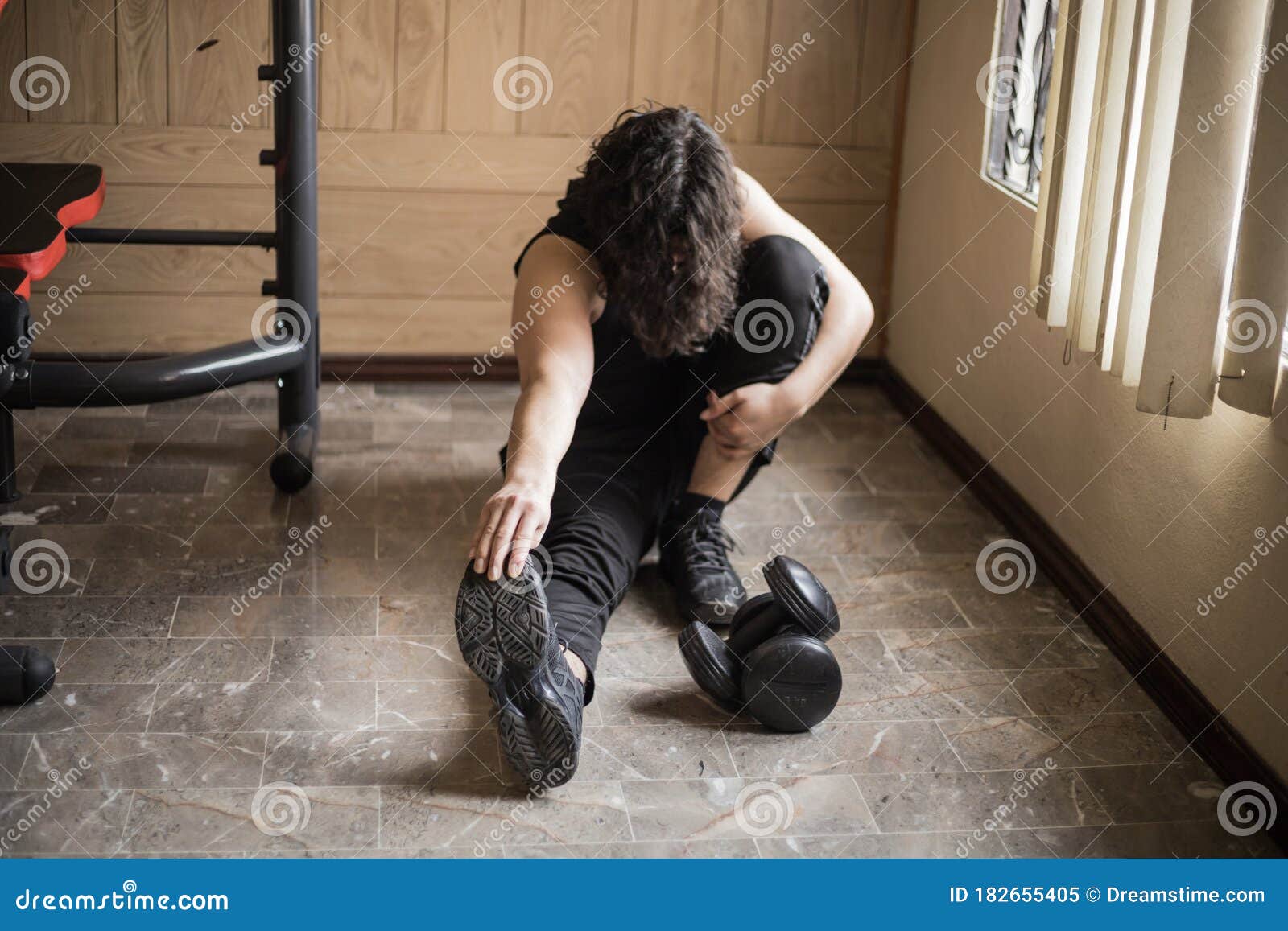 A boy exercising at home stock image