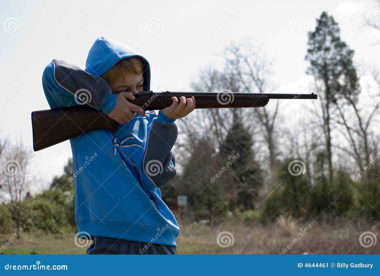 boy firing rifle