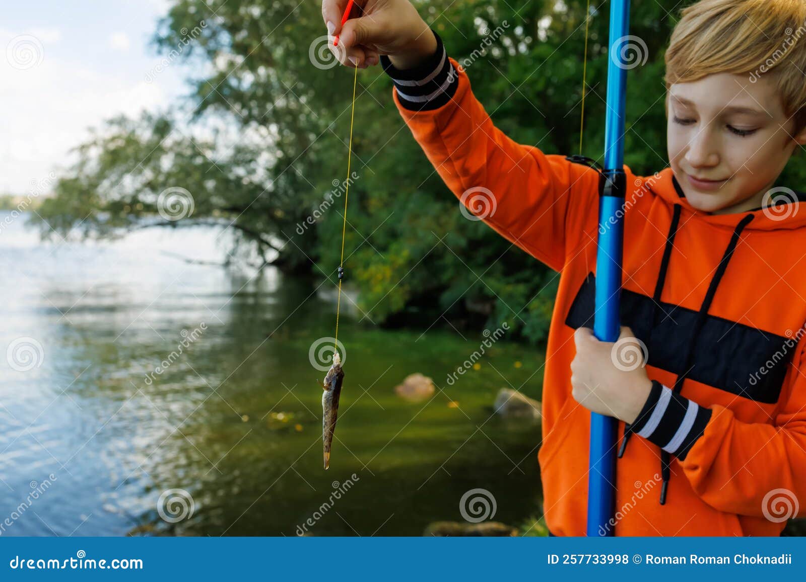 Boy Holds Little Fish Stock Photos - Free & Royalty-Free Stock