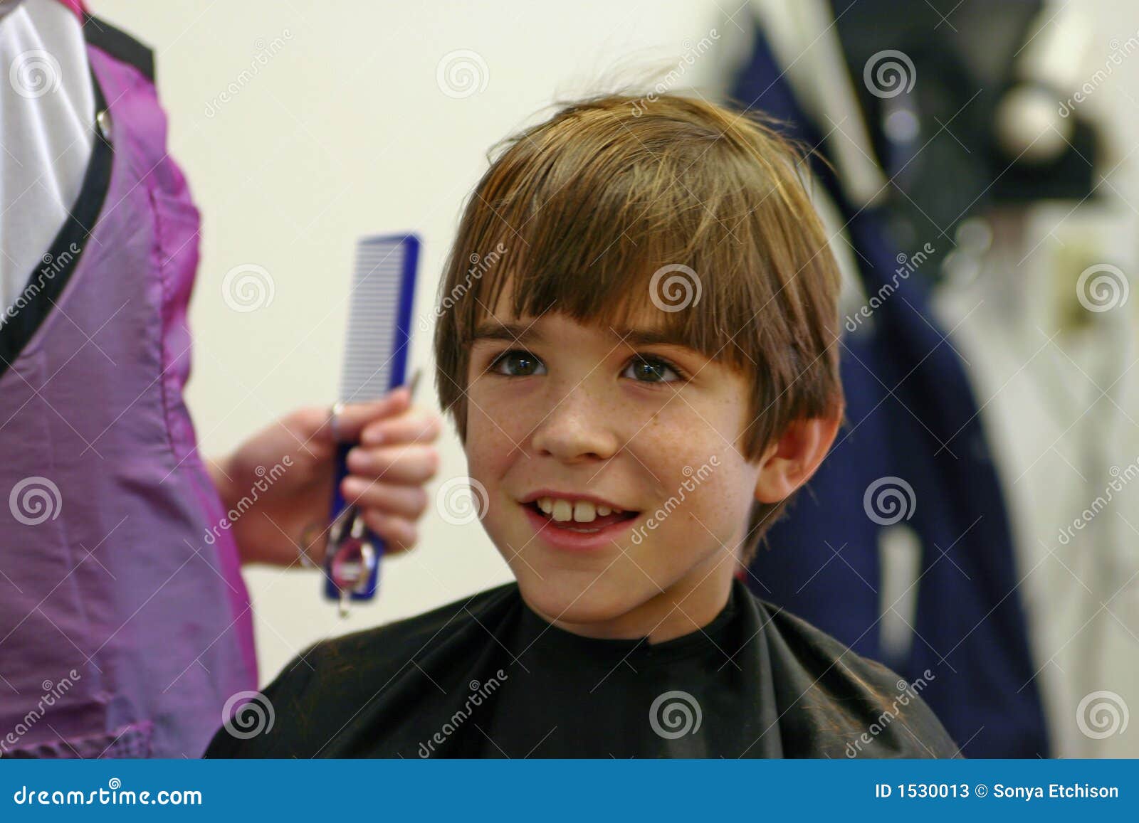 Boy Getting a Haircut stock image. Image of barber 