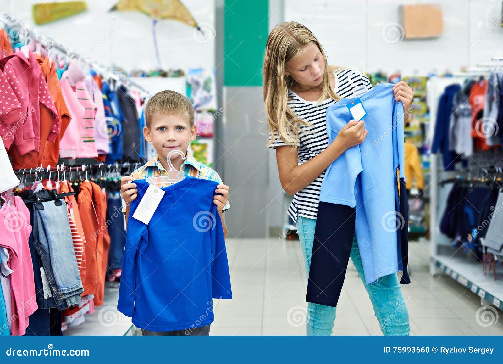Boy And Girl In Clothing Store Stock Photo Image Of Childhood Males boy-and-girl-in-clothing-store-stock-photo-image-of-childhood-males