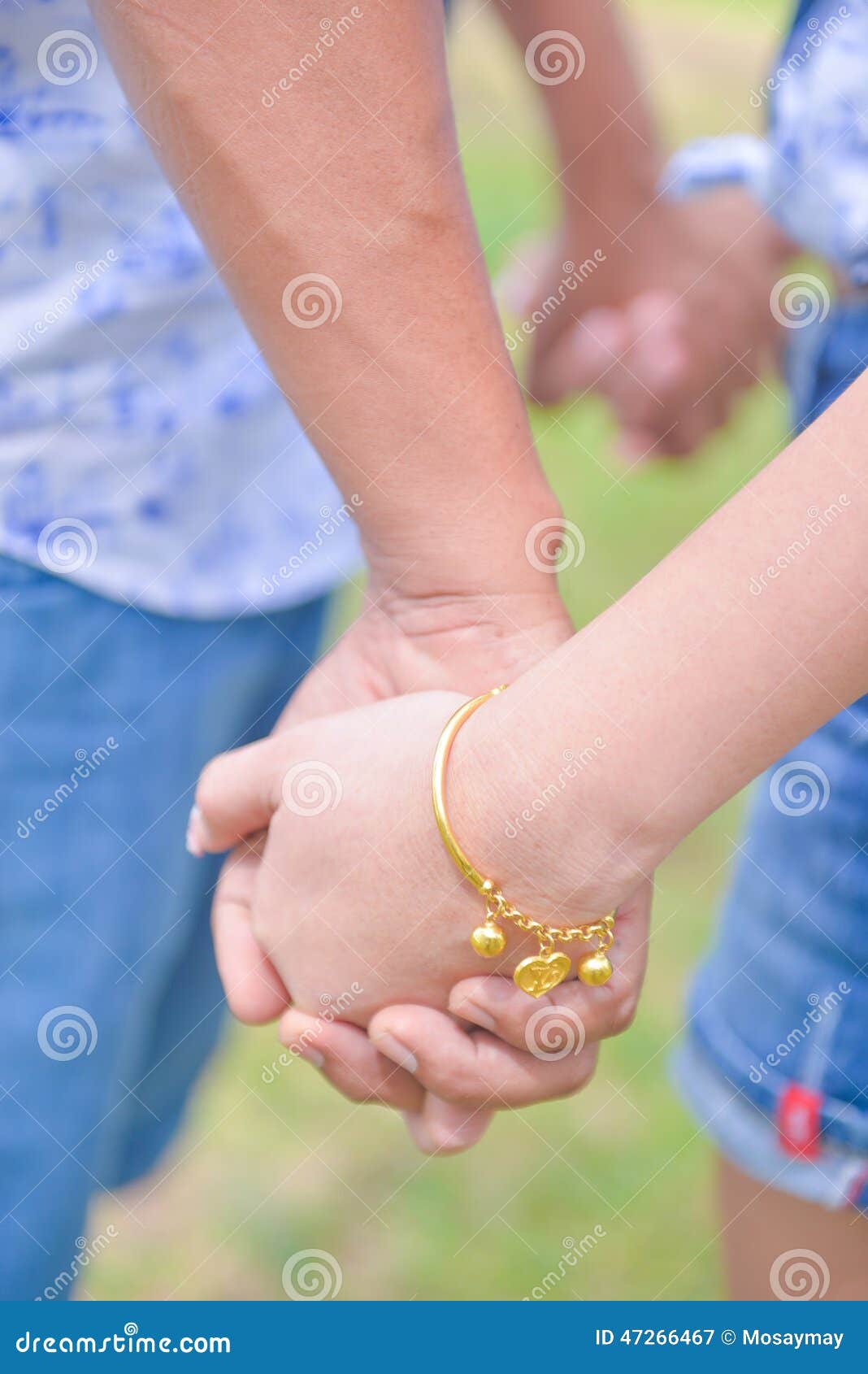 Boy and Girl Holding Hand Together Stock Image - Image of gold ...