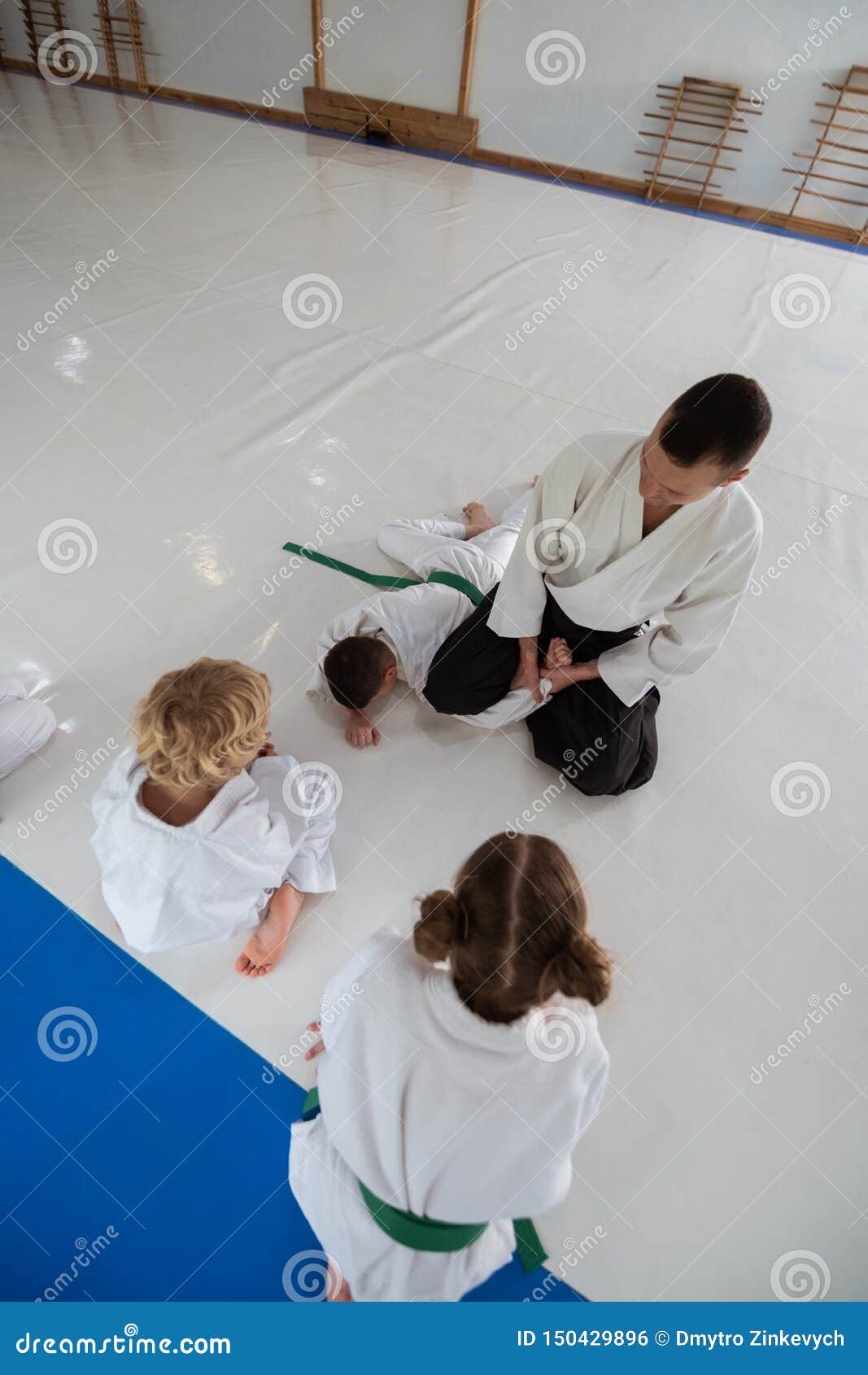 Boy and Girl Looking at Their Aikido Trainer Doing Hack on Boy Stock Photo  - Image of lesson, hardworking: 150429896
