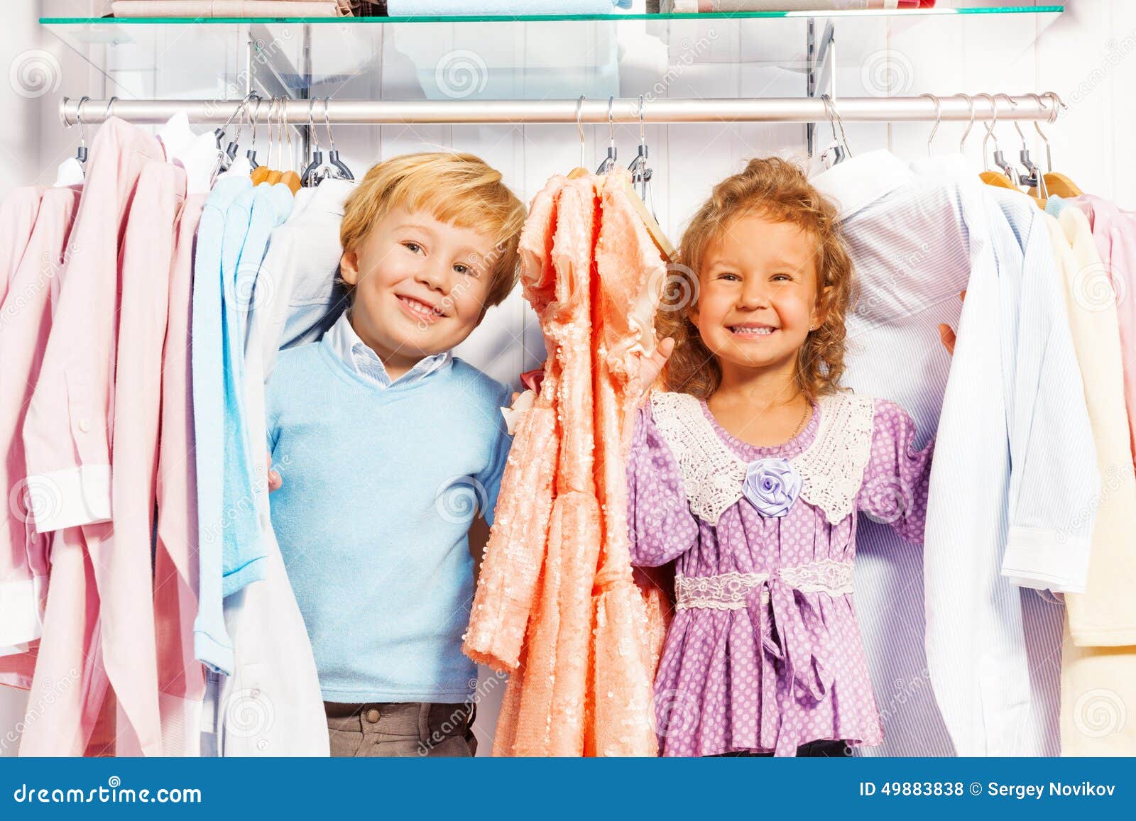 Boy and Girl Play Hide-and-seek in Clothes Stock Photo - Image of child ...