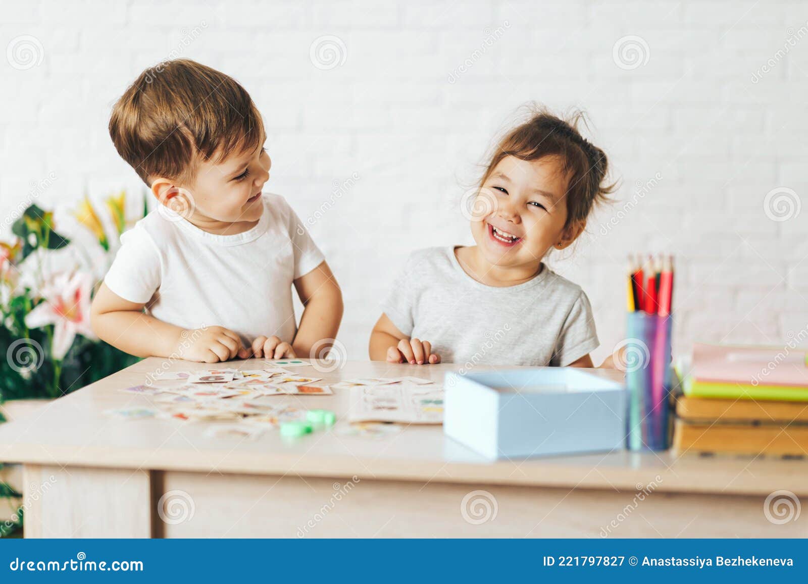Boy and Girl Playing Educational Games in the School Class Stock Image