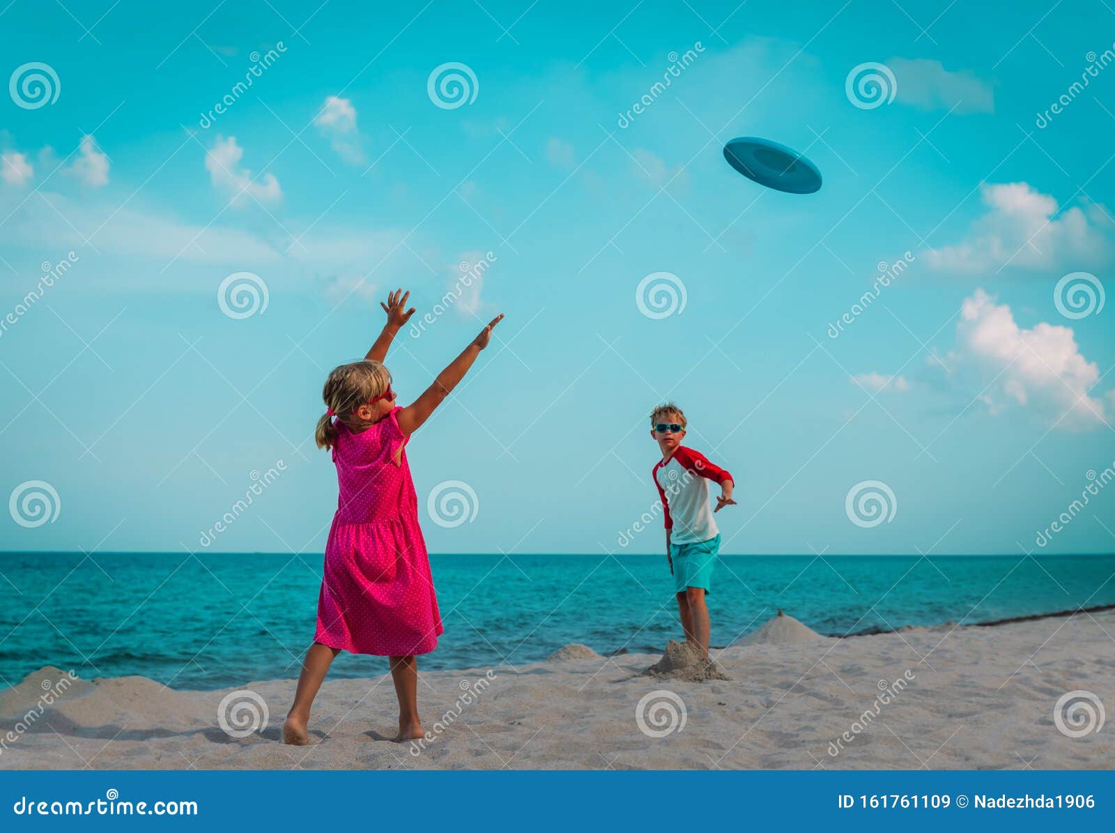 Boy and Girl Playing with Flying Disc at Beach Stock Image Image of