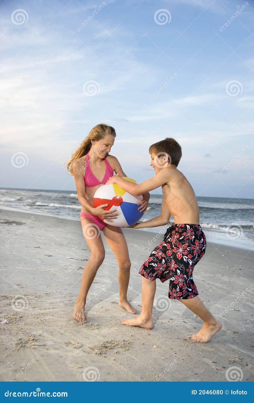 Boy and Girl Pulling on Ball Stock Photo Image of brother, island