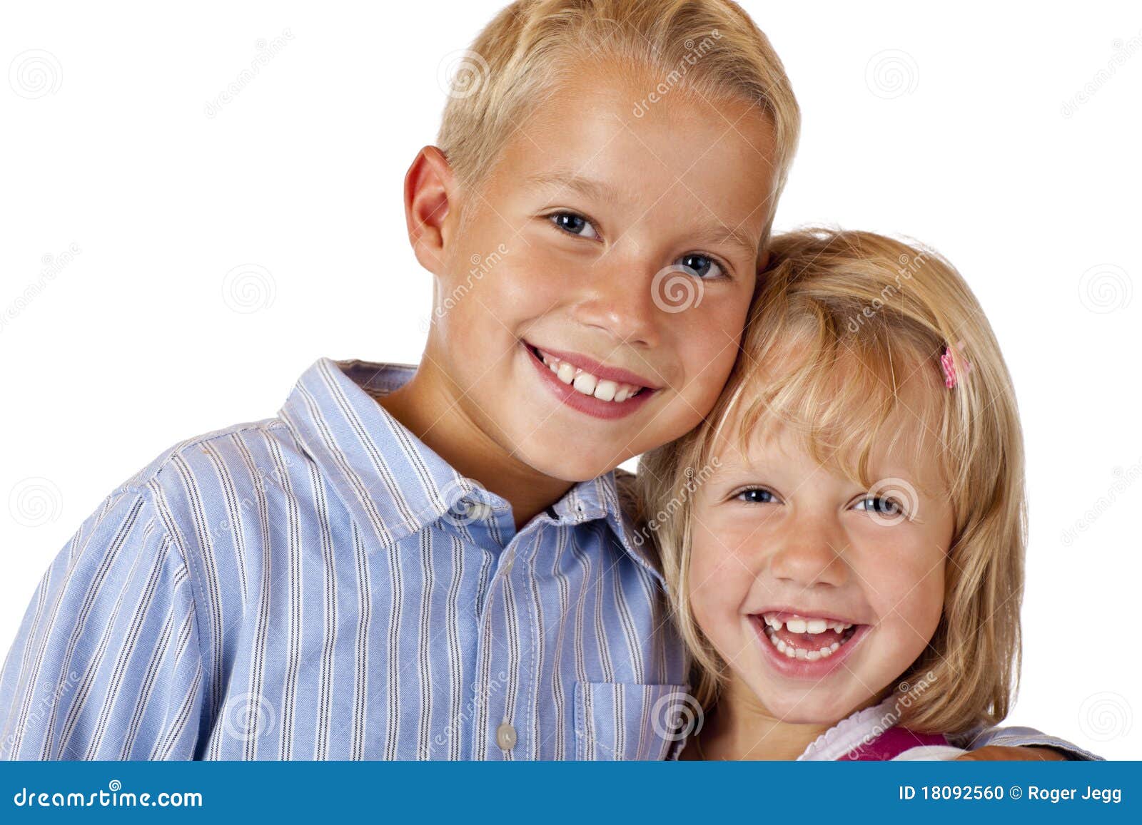 boy and girl are smiling happy into camera