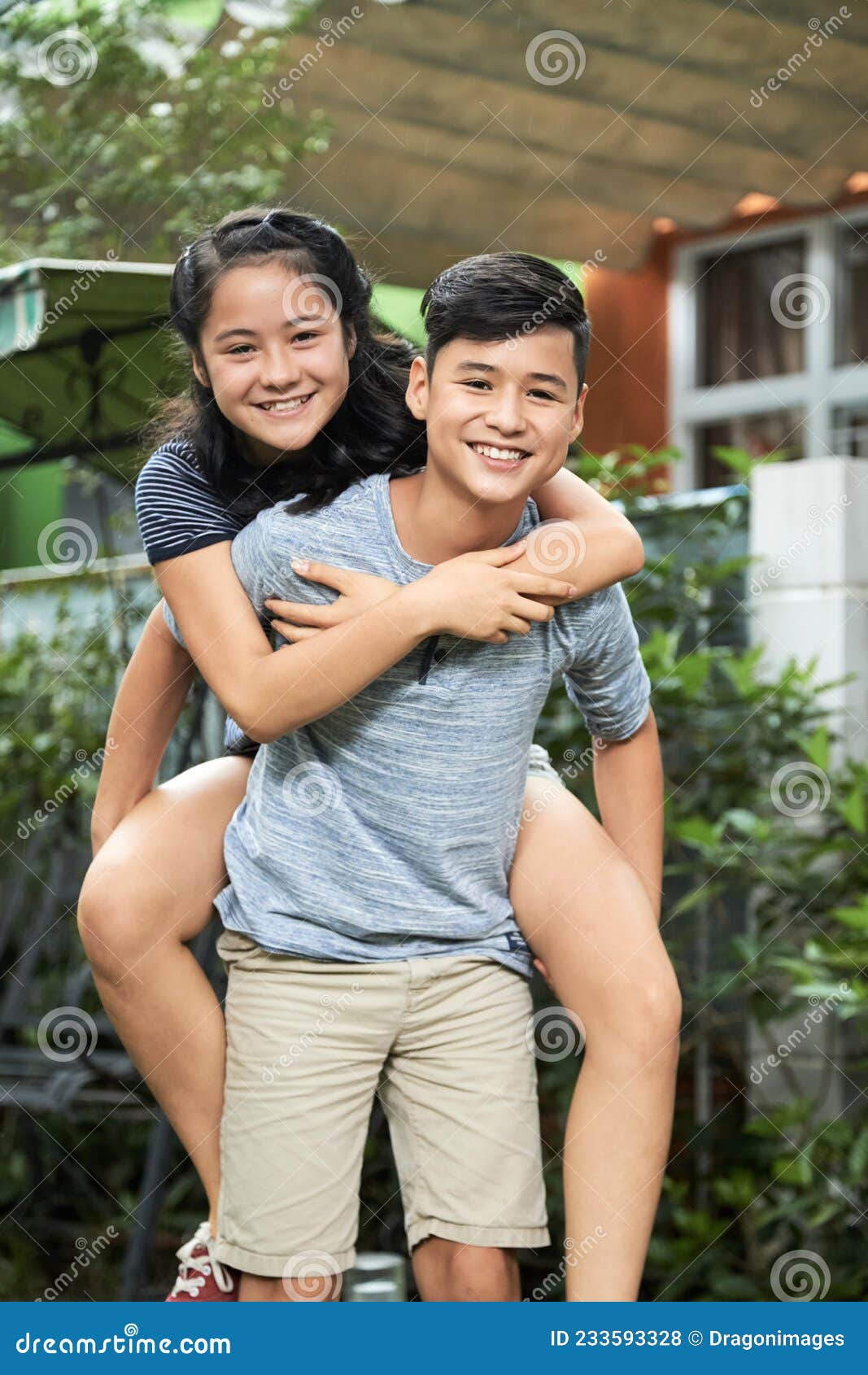 Boy Giving Piggyback Ride To Twin Sister Stock Photo - Image of game,  friend: 233593328