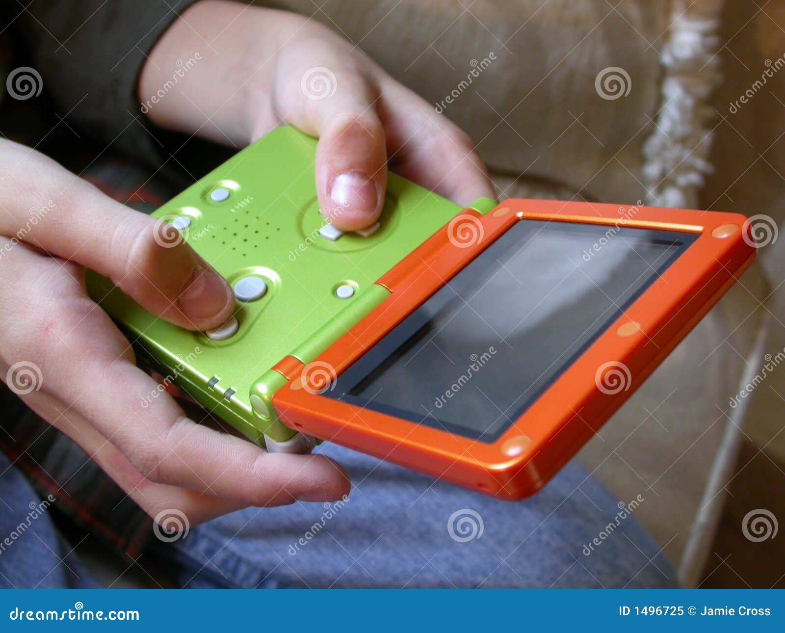 boy and handheld video game close up