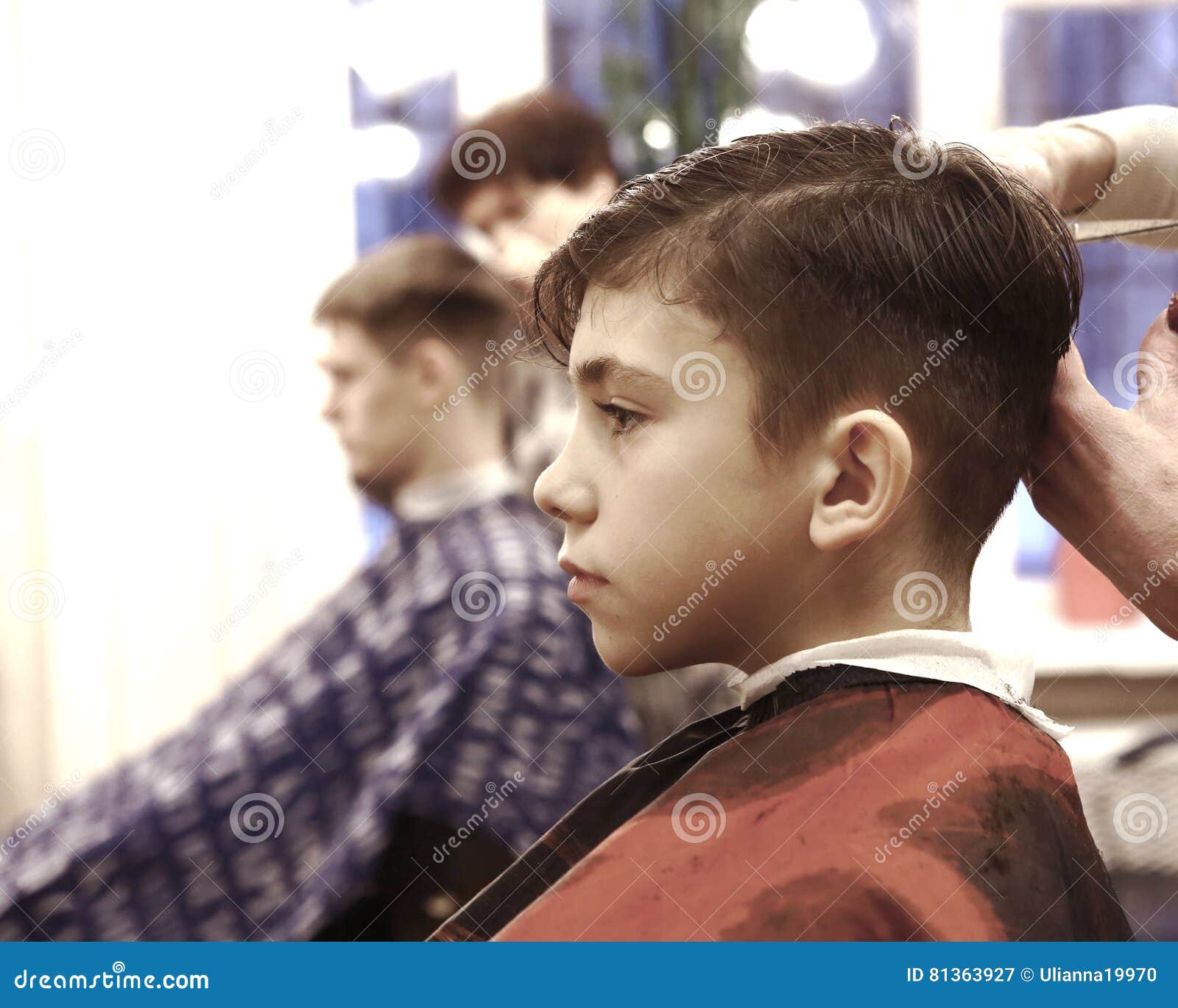 Boy Has His Hair Cut In Barber Shop Men Room Editorial Photography