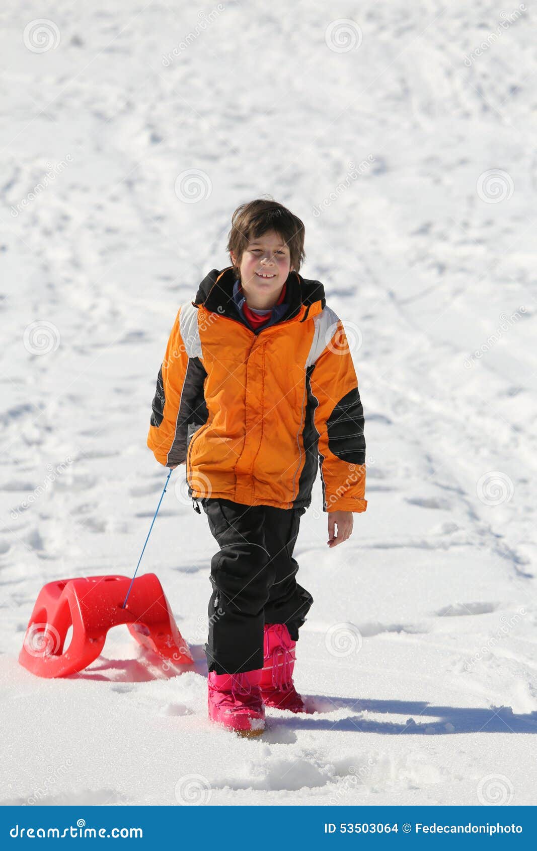 Boy Having Fun on the Red Sleigh Stock Photo Image of people