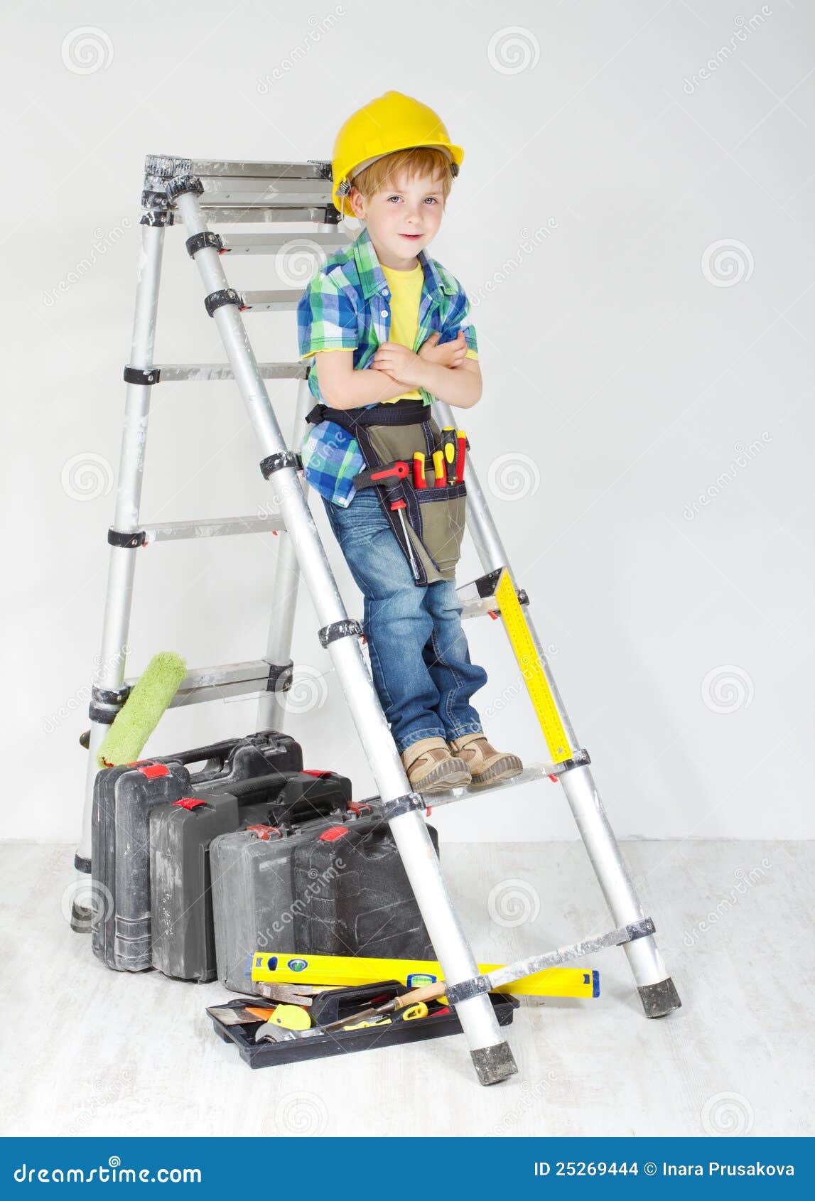 Boy with Helmet and Tool Belt on Stepladder Stock Photo Image of