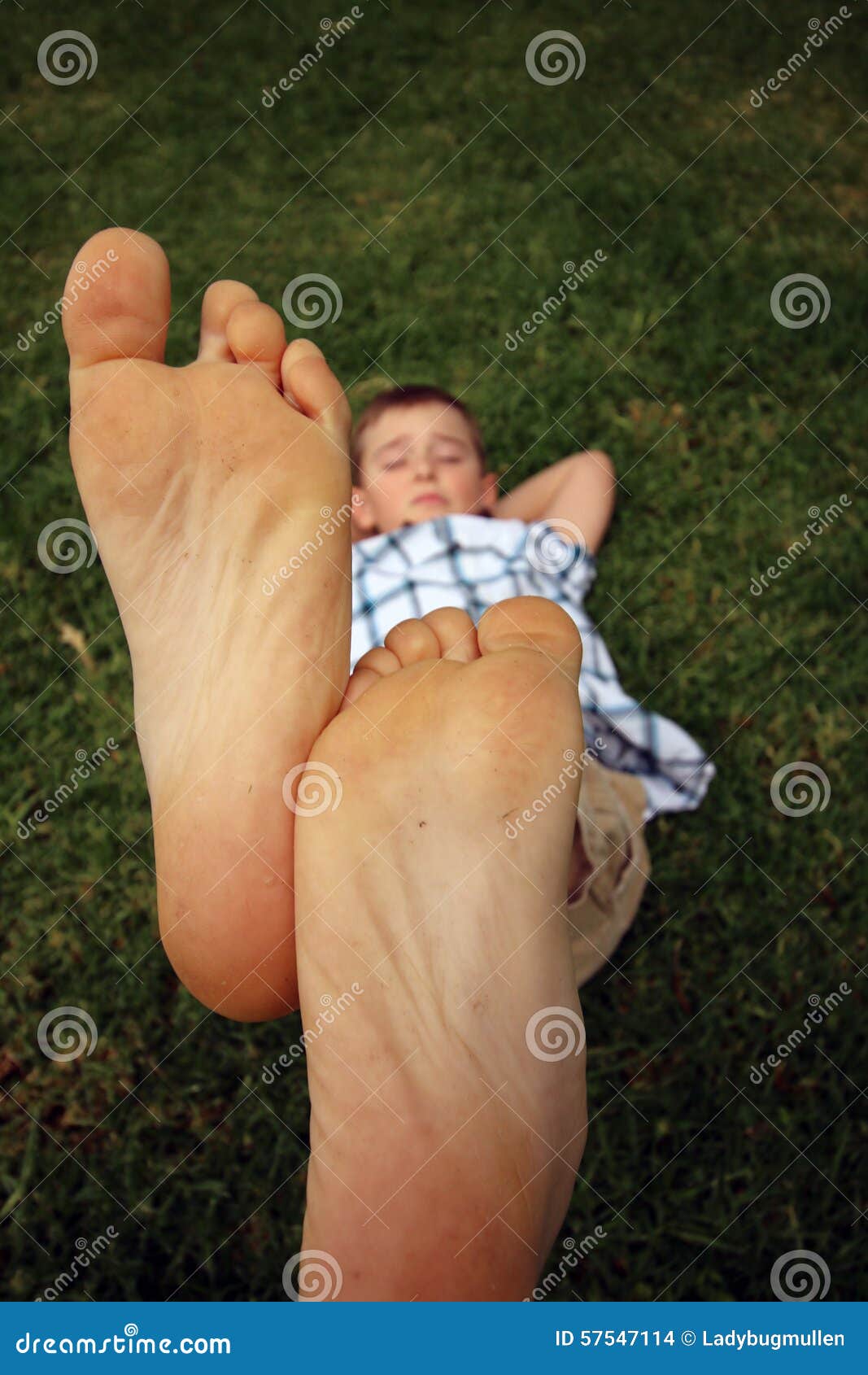 boy with his feet together in the air