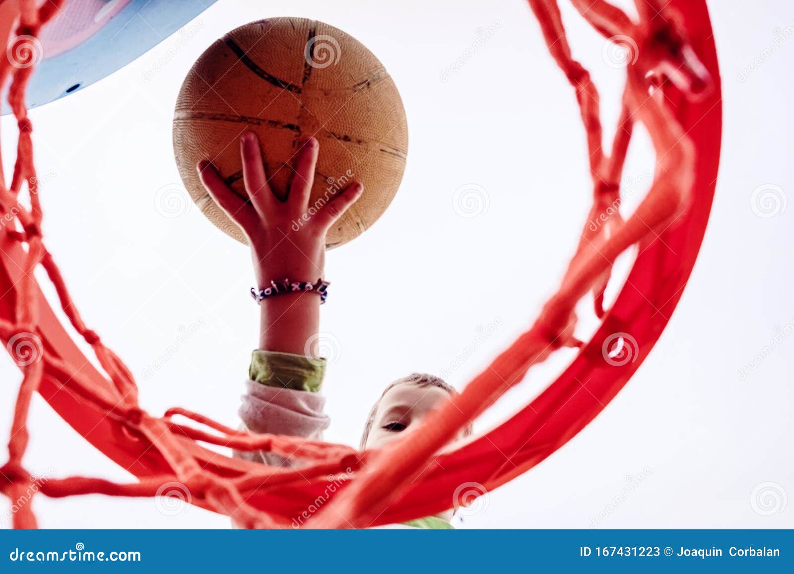 Boy Hitting a Basketball, Seen from Below Stock Image Image of people