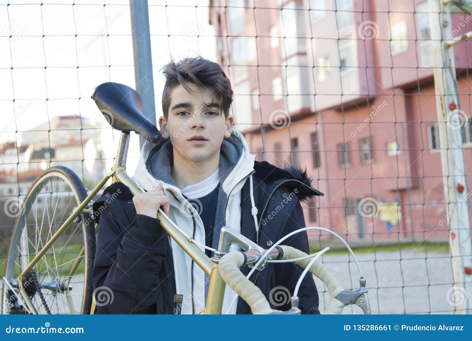 Boy holding bike stock image. Image of trendy, teen - 135286661