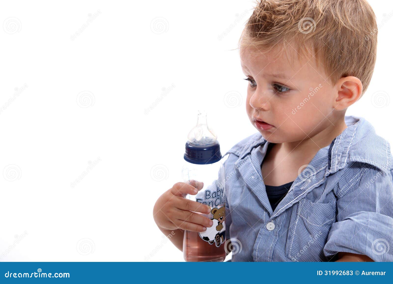 Boy holding bottle stock image. Image of blue, child 31992683