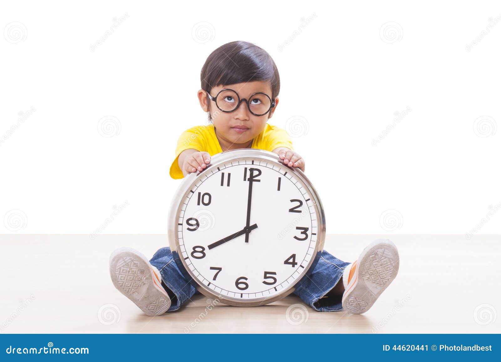 Boy holding clock stock image. Image of childhood, 44620441