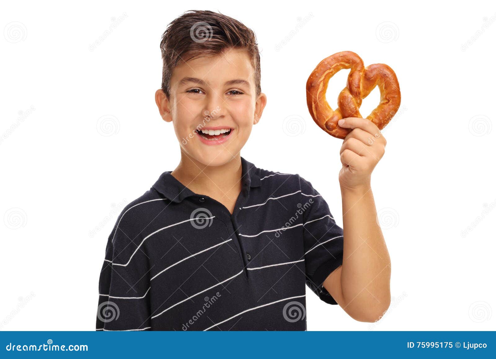 Boy holding a pretzel stock image. Image of holding, male 75995175