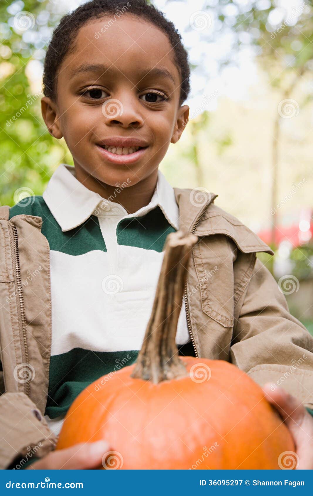 Boy holding a pumpkin