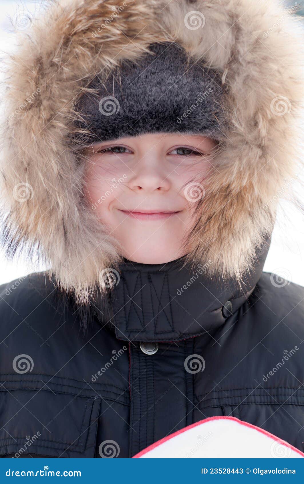 Boy in a jacket with fur stock image. Image of winter 23528443