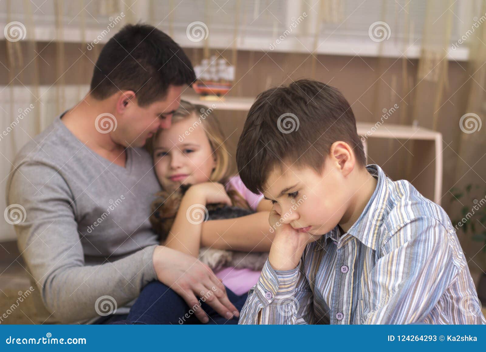 The Boy is Jealous of His Father`s Sister and Sad. Stock Image Image