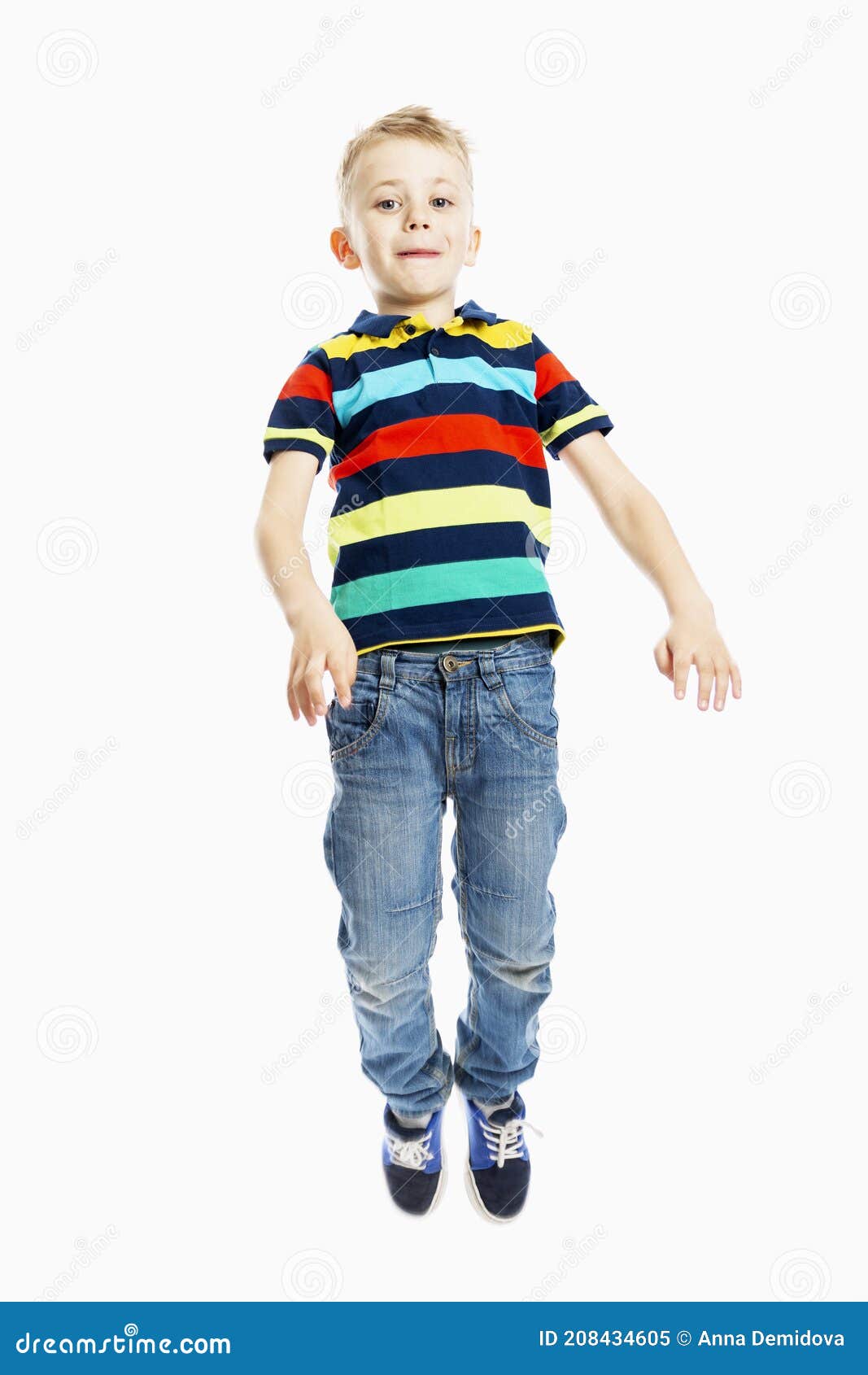 A Boy in Jeans and a Multicolored T-shirt is Jumping. White Background ...