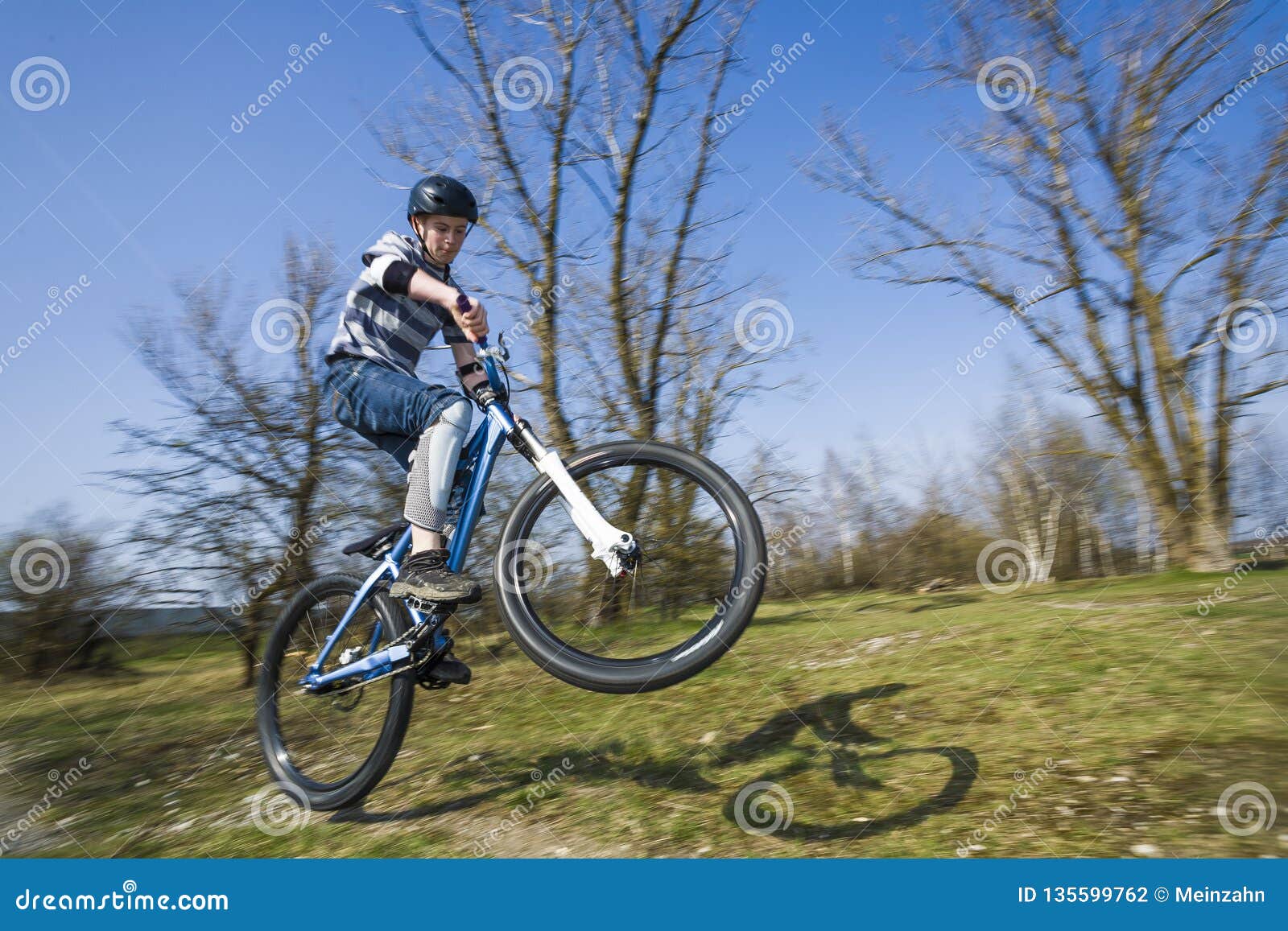 Boy Jumping with His Dirt Bike Stock Photo - Image of helmet, teenager ...
