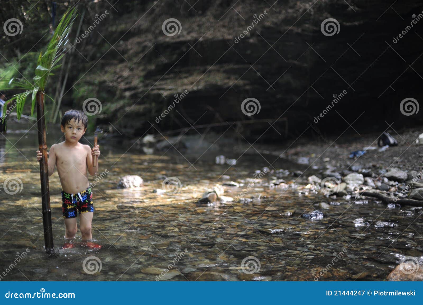 Boy In A Jungle With A Palm Leaf Royalty Free Stock Photography Image