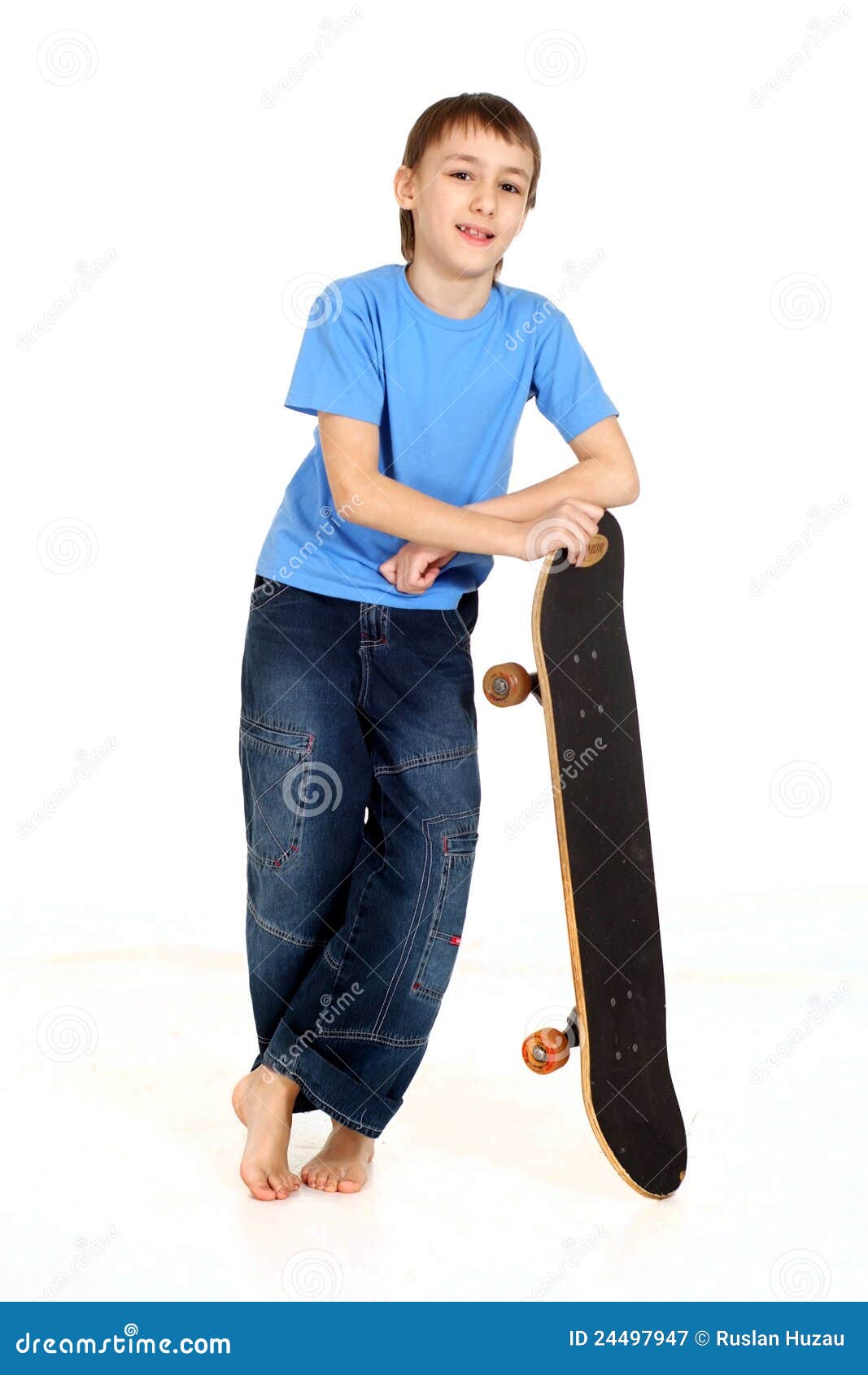 Boy leaning on skateboard stock image. Image of childhood 24497947