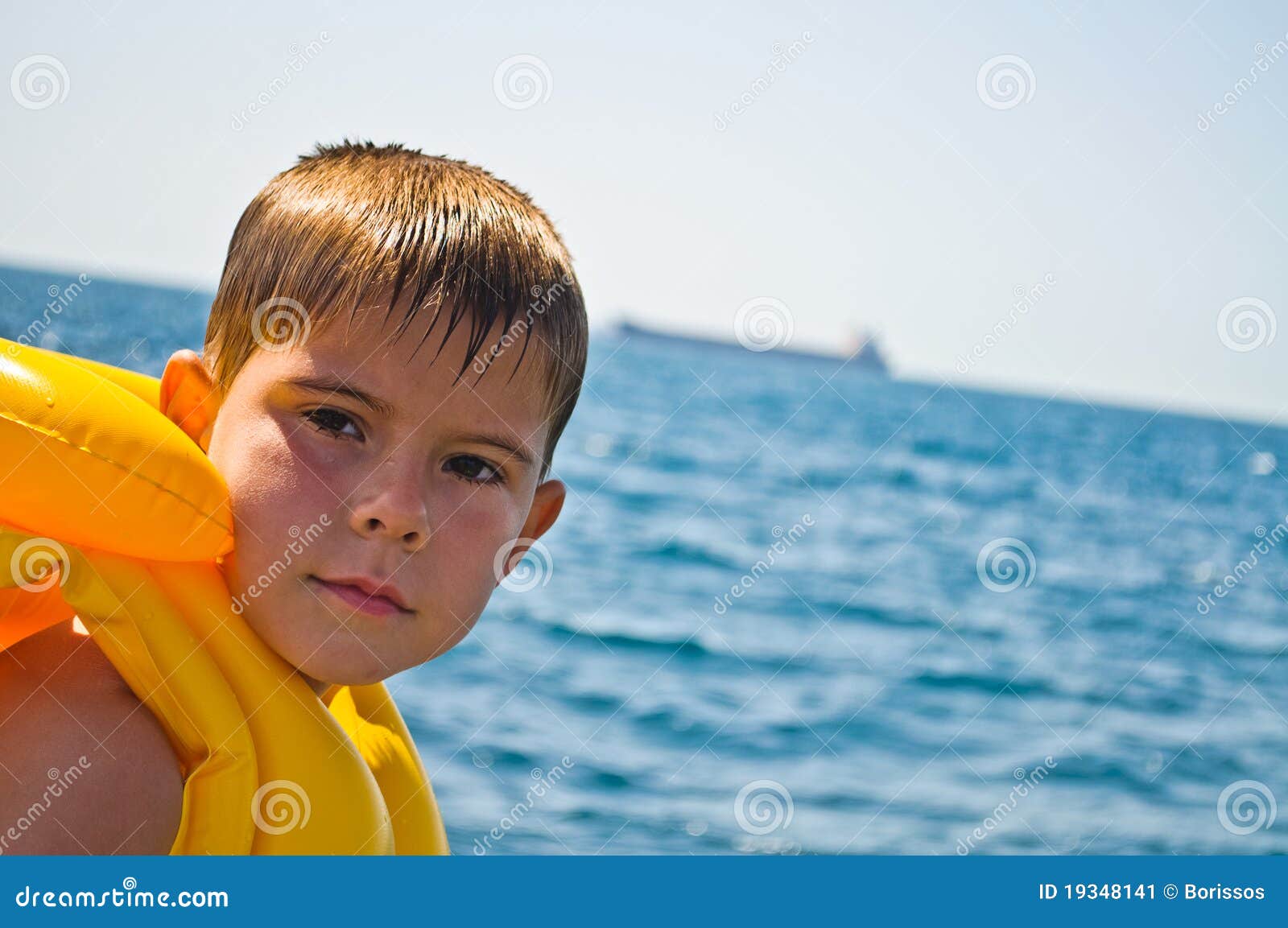 Boy in life jacket stock image. Image of lifejackets 19348141