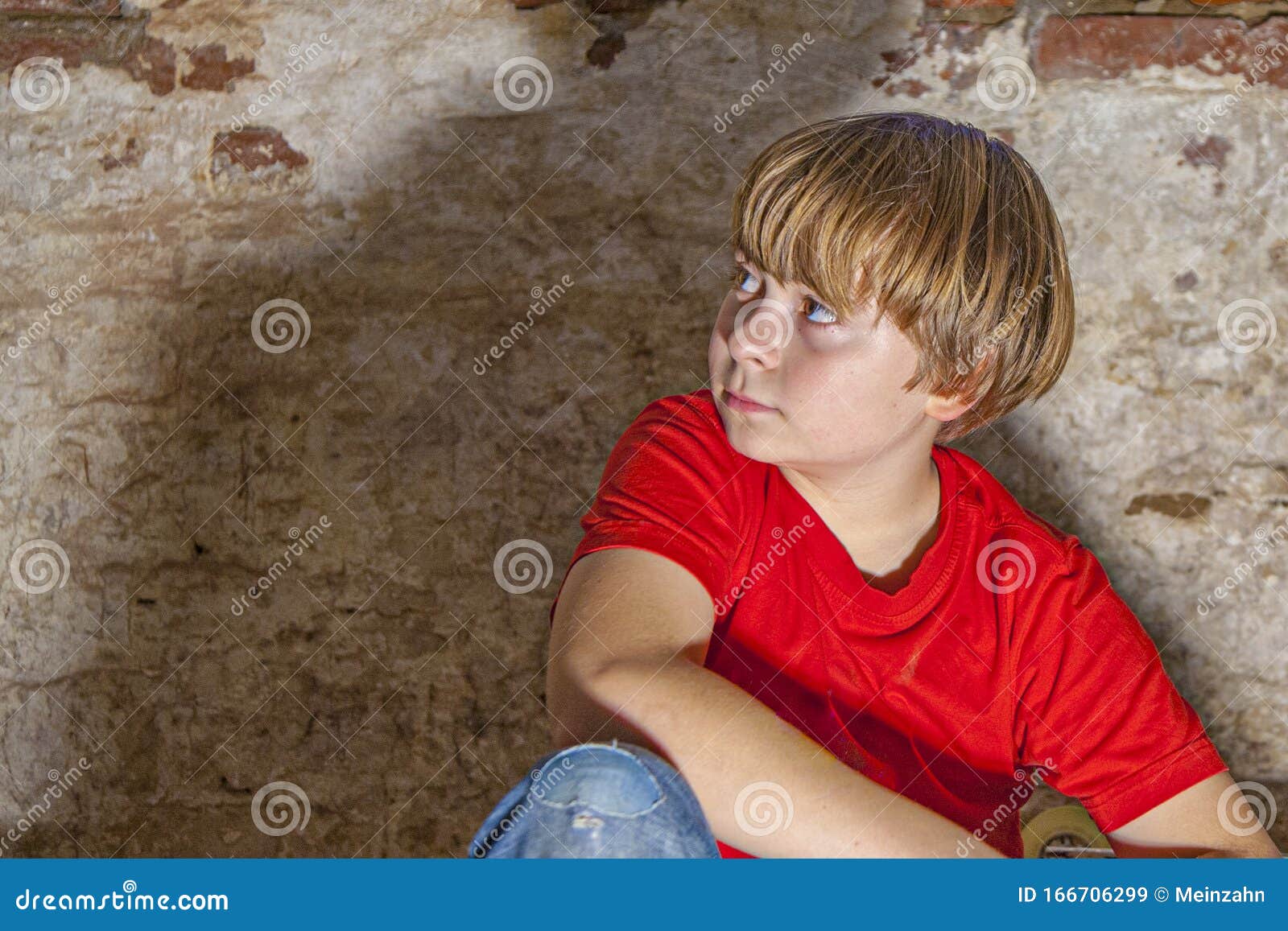 Boy With Light Brown Hair And Brown Eyes Lookes Friendly Happy