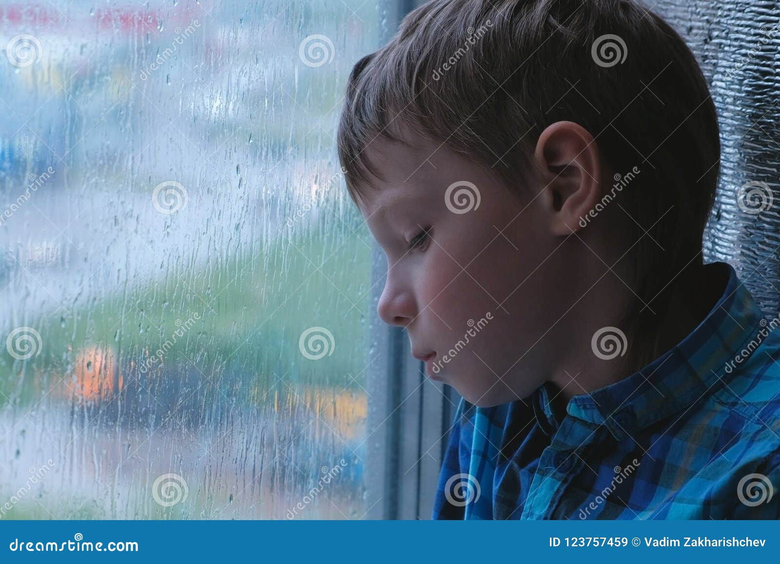 sad boy in the rain