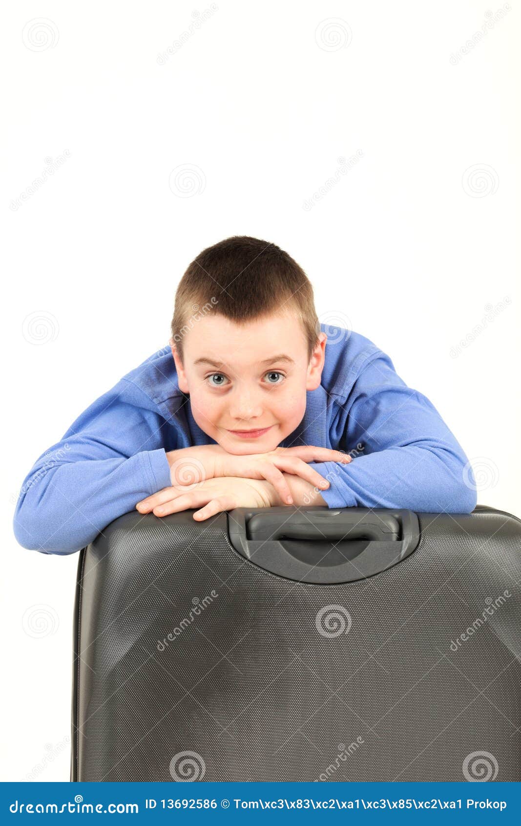 Boy with luggage stock photo. Image of shirt, brown, shot 13692586