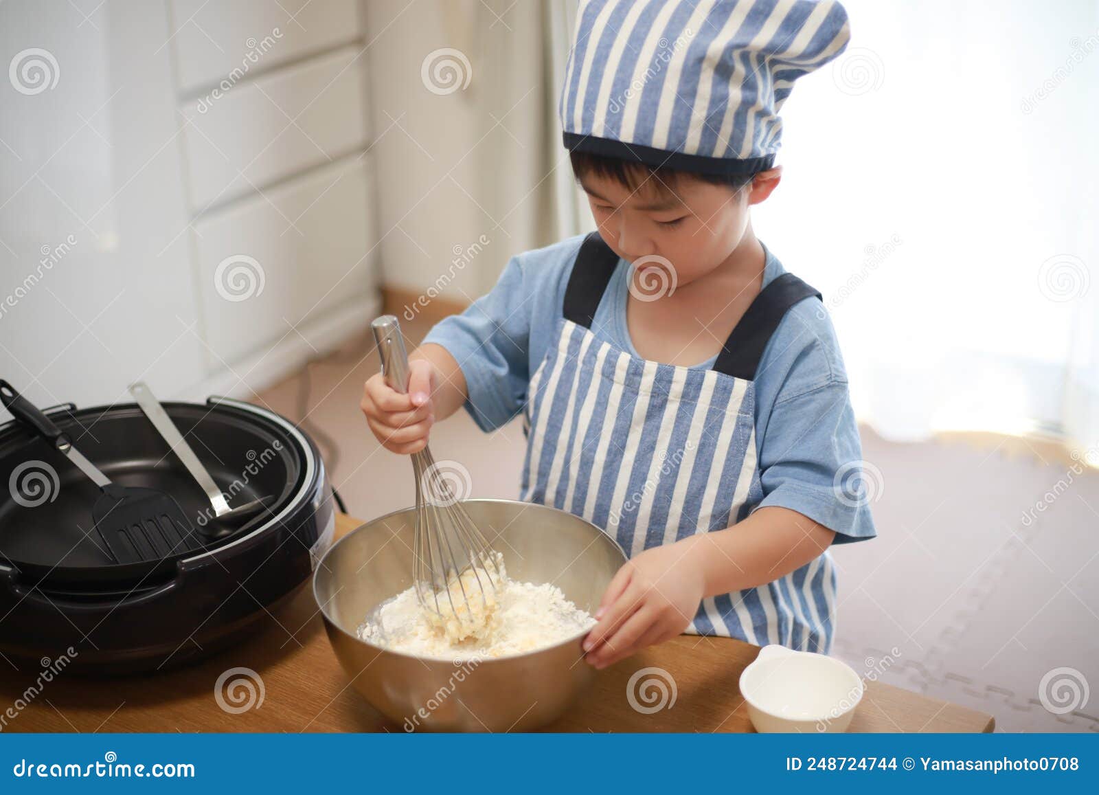 Boy making pancakes stock photo. Image of japanese, water 248724744