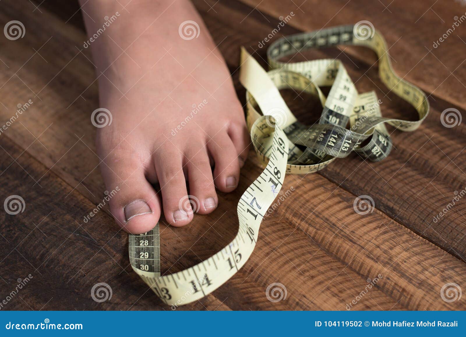 Boy Measure His Feet Using Measuring Tape Stock Photo - Image of  activities, appearance: 104119502